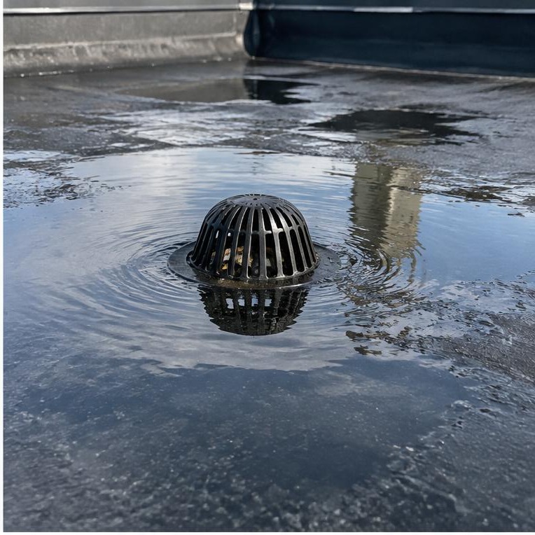Ponding water around a low-slope roof drain