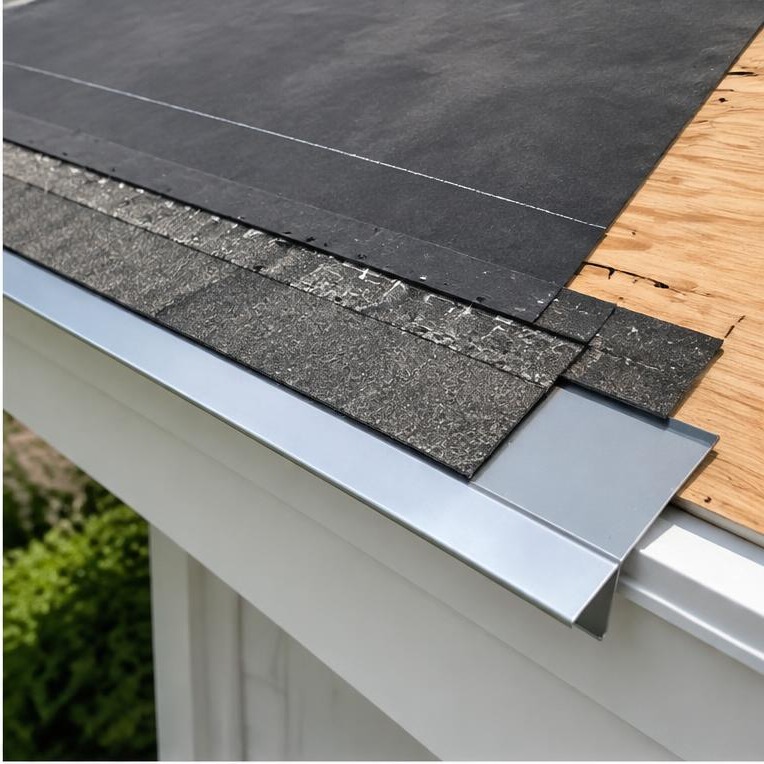 Starter strip and metal drip edge at a shingle roof eave